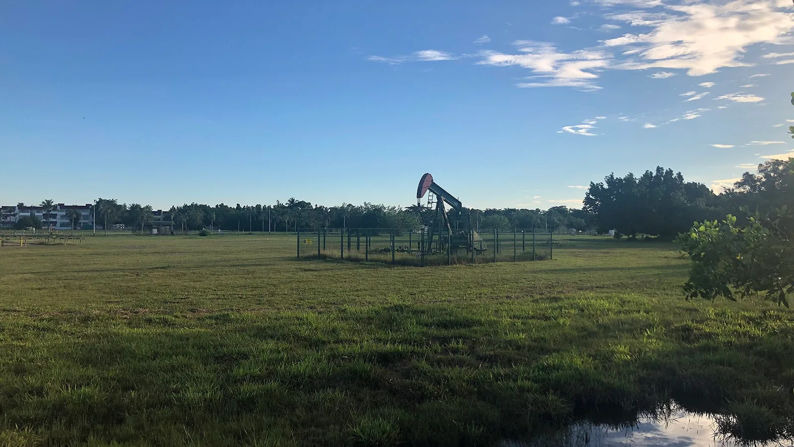 An oil pumpjack in a field