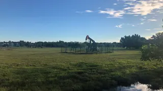 An oil pumpjack in a field