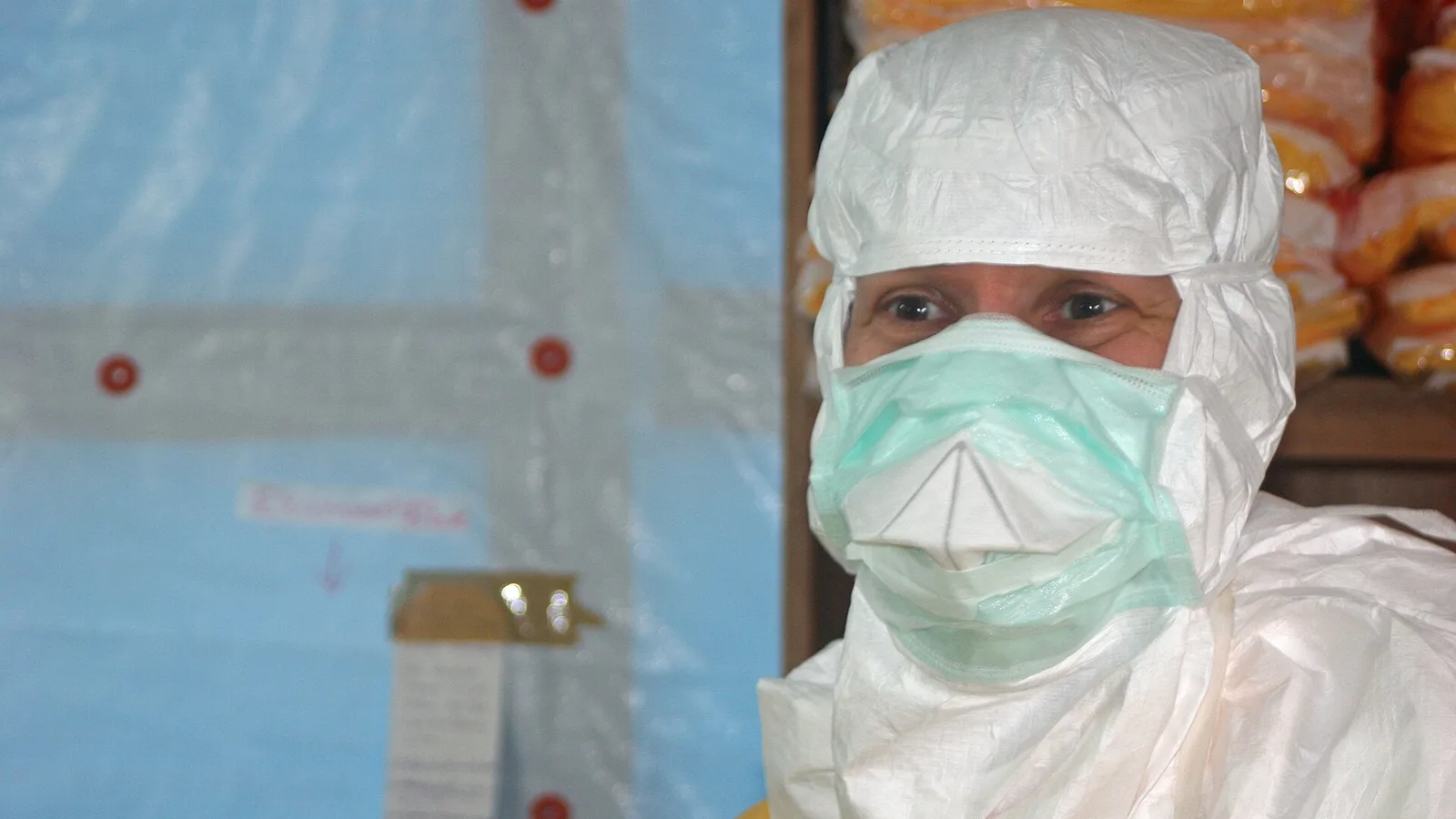 The director of the U.S. Centers for Disease Control and Prevention enters an Ebola treatment unit during an earlier outbreak.