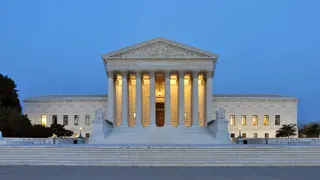 The US Supreme Court building in Washington at dusk