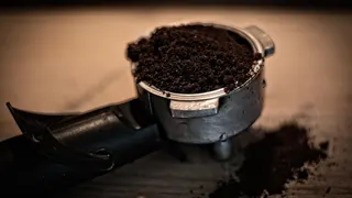 Ground coffee in an espresso basket